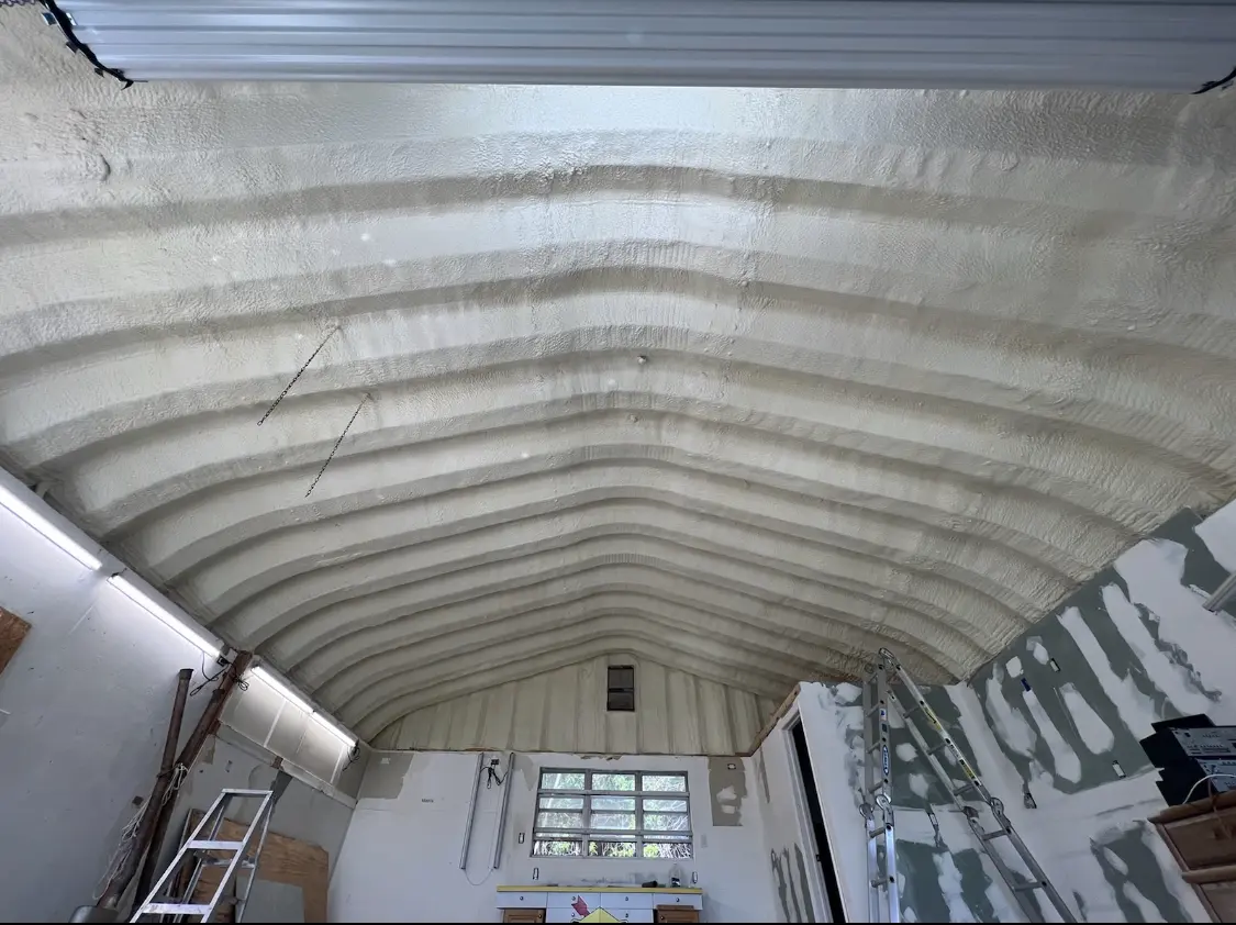 Spray polyurethane foam applied to the underside of a metal roof deck in Carlisle
